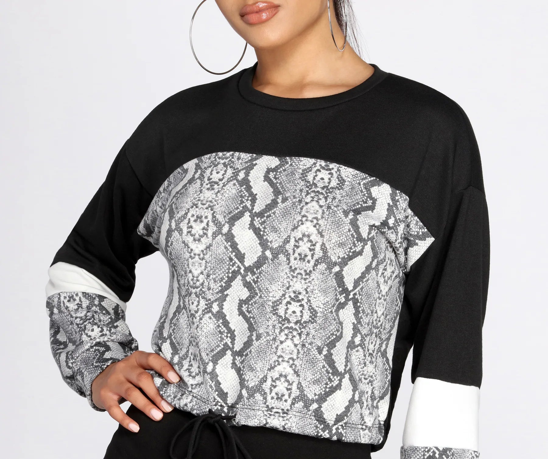 women's tops for those who want to stay on top of the latest fashion trends and wear pieces that are both stylish and on-trendSnake Print Color Block Top